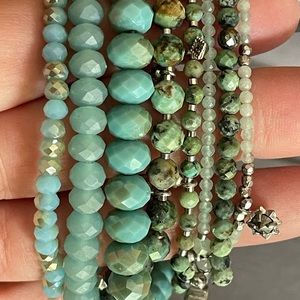 Multiple turquoise bracelets